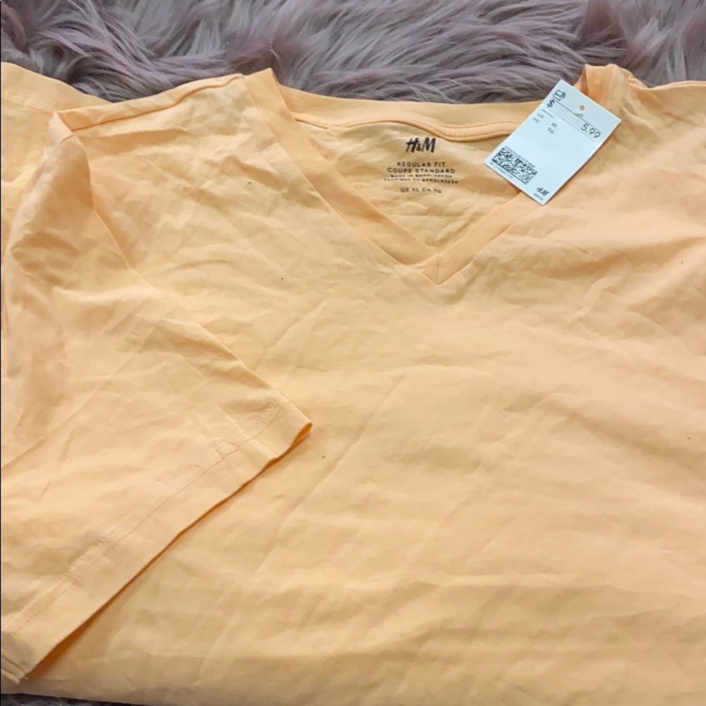 Peach colored short sleeve shirt